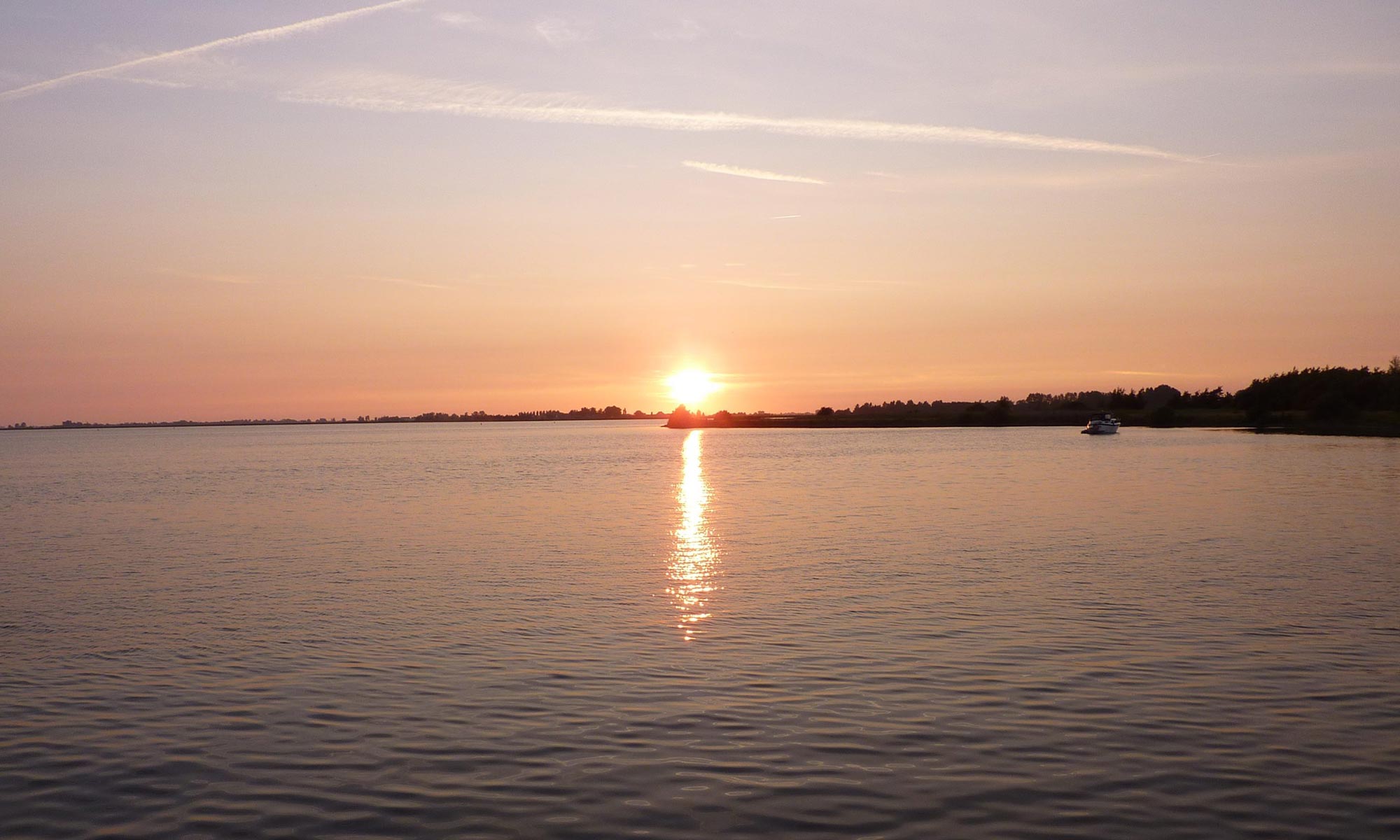 Sailing club trip sunset in Netherlands
